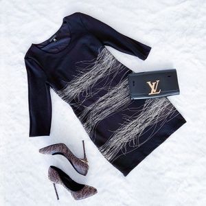 $199 | Waggon Paris | fashion little black stretch dress gold accents 3/4 sleeve